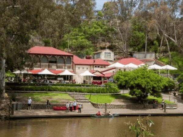 Family-walking-along-Yarra-River-at-Yarra-Bend-Park-with-bridges-and-nature-views.