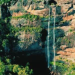 Full view of Dandongadale Falls, Victoria’s tallest waterfall, cascading down the cliff in the High Country