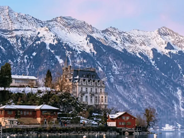 Iseltwald village covered in snow with mountains in the background