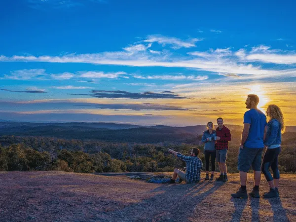 Group of people enjoying sunset views at Mt Pilot Lookout in Victoria