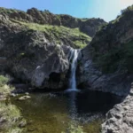 Full view of Paradise Falls in King Valley, Victoria, cascading over a rocky cliff into the gorge