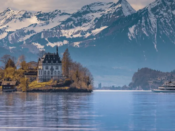 Snow covered mountains near Iseltwald village in winter Switzerland
