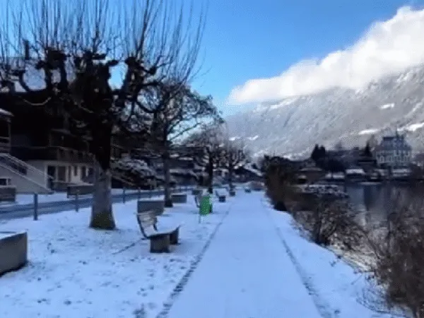 Snow covered pathway through Iseltwald village in winter