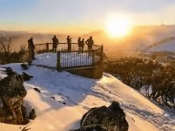 Sunset view from Mt Higgi Lookout at Mount Hotham with snow-covered alpine scenery