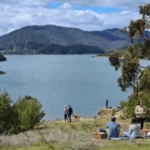 People enjoying the lakeside at Lake Eildon National Park in Victoria