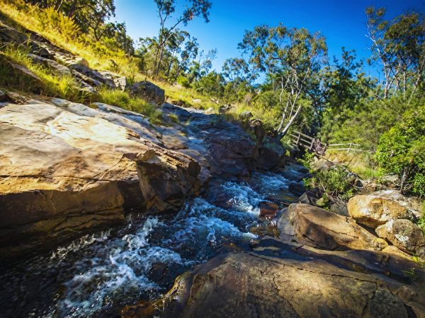 Rocky creek flowing through Yackandandah Gorge surrounded by bushland