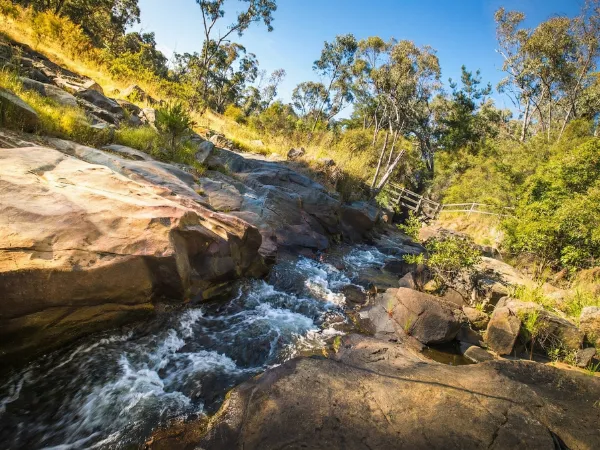 flowing-canal with-clear water-running through-natural bushland
