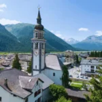 Bever village church with traditional Engadin houses in Graubünden Switzerland