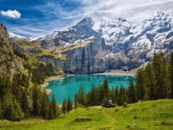 Oeschinensee Switzerland with turquoise alpine lake surrounded by mountains near Kandersteg