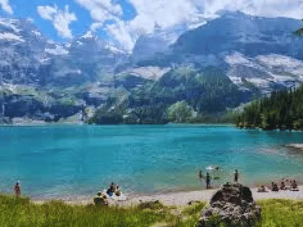 Oeschinensee Switzerland with turquoise alpine lake surrounded by mountains near Kandersteg