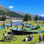 People enjoying outdoor recreation and sports at Mulets Sports Center in Silvaplana