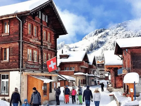 Traditional Swiss alpine village streets with wooden houses and snow in winter