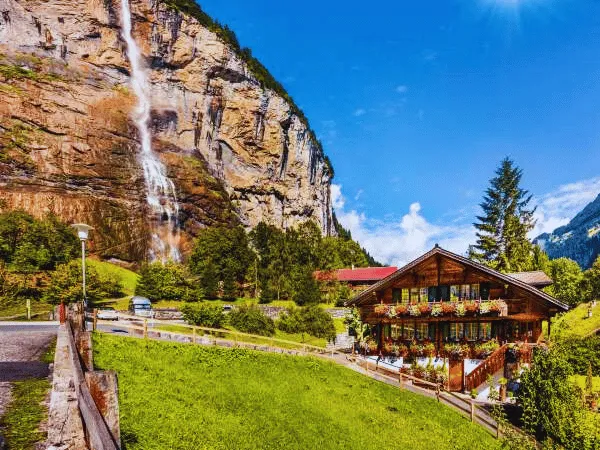 multiple waterfalls flowing down steep cliffs in lauterbrunnen valley switzerland