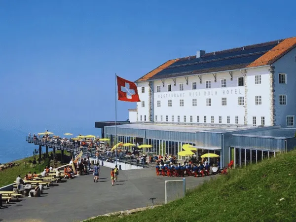 rigi-kulm-hotel-and-restaurant-with-swiss-flag-on-sunny-day