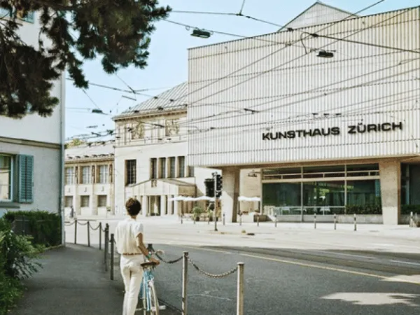 person-with-bicycle-standing-in-front-of-kunsthaus-zurich-art-museum
