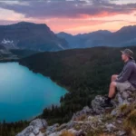 lessexplore-explorer-cliff-overlook-sunset-lake
