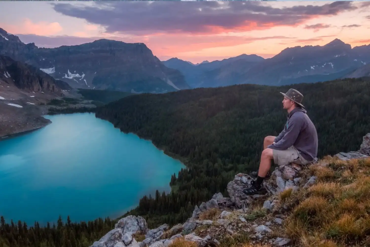 lessexplore-explorer-cliff-overlook-sunset-lake