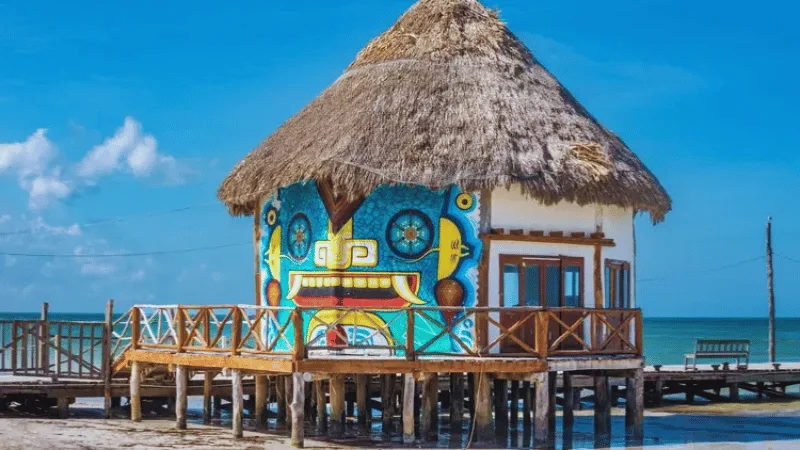 Colorful painted hut with thatched roof on Isla Holbox pier