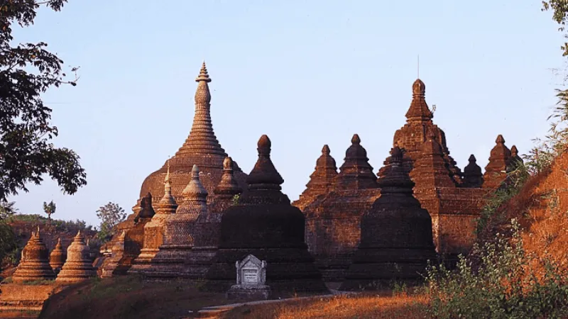 Cluster of ancient stupas at Mrauk U during golden hour
