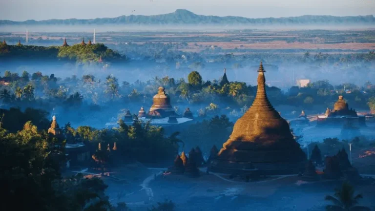 Mrauk U temples rising through morning mist in Myanmar