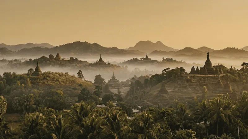 Panoramic sunset view of Mrauk U temples and hills