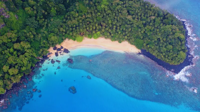 Aerial view of secluded beach and coral reef in Príncipe island