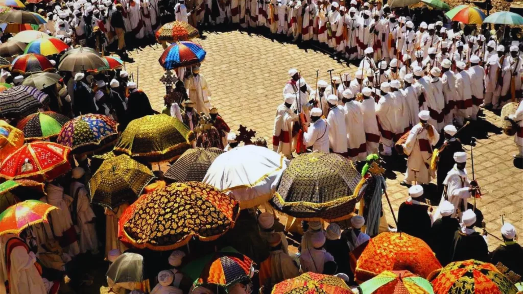 Aerial view of Timkat festival procession with ceremonial umbrellas in Ethiopia
