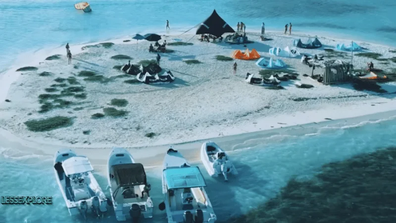 Aerial view of boats and beach setup in Los Roques Archipelago