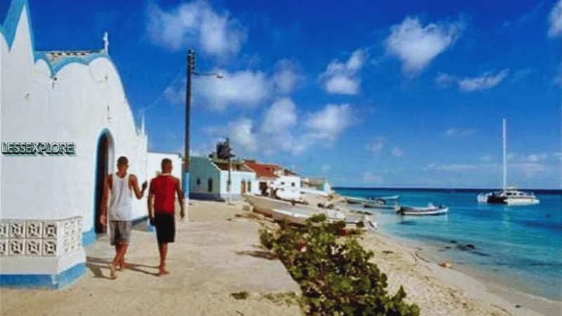 Two people walking through Gran Roque village in Los Roques Archipelago