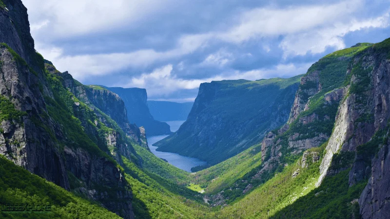 Western Brook Pond fjord surrounded by green cliffs in Gros Morne National Park