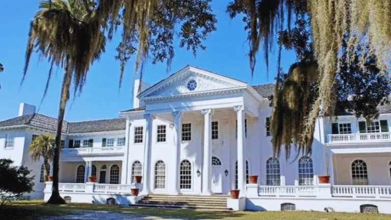 Plum Orchard Mansion white Georgian Revival exterior with Spanish moss trees